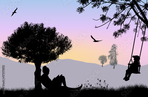 Woman reading a book under the tree on beautiful landscape