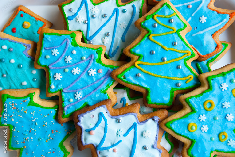 Christmas background with homemade gingerbreads.Christmas trees cookies icing. Xmas card.Holiday dessert.