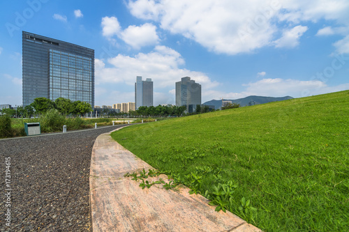 beautiful green meadow near modern office building. © hallojulie