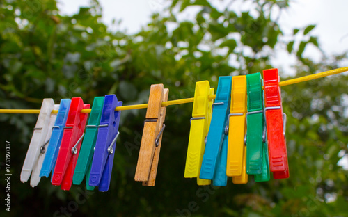 Plastic clothespins hanging on a clothesline