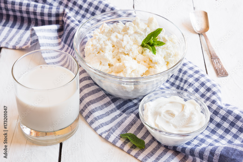 Dairy products in glass dishes on White wood Dairy products in glass dishes on White wood