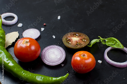 Schilderij op canvas Spices and herbs for cooking dinner - ,slised tomato, onion, salt, pepper, garlic