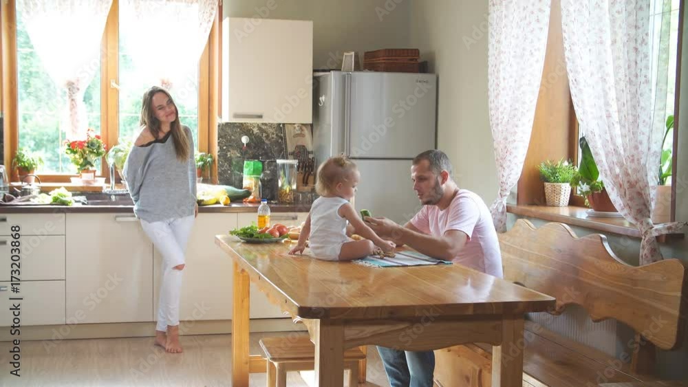 Young family having fun in the kitchen. Young family having fun in the kitchen.