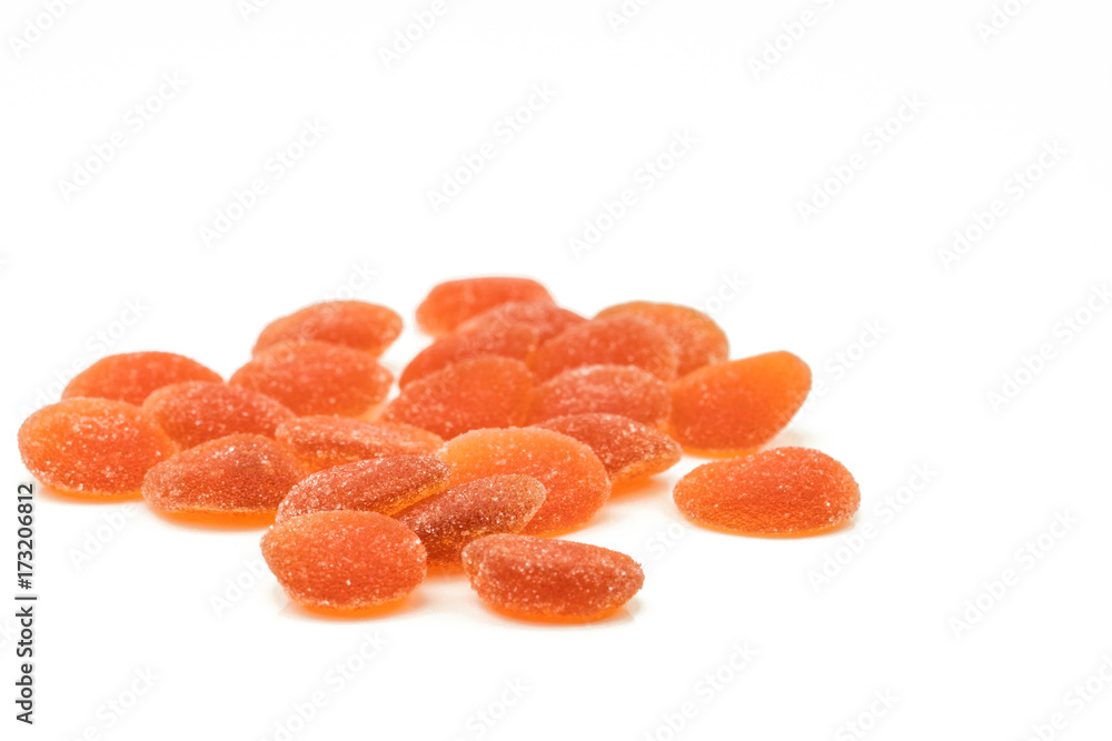 Pile of orange flavored vitamin pastille with clipping path. Multivitamin gummy for kids to be healthy concept Pile of orange flavored vitamin pastille with clipping path. Multivitamin gummy for kids to be healthy concept