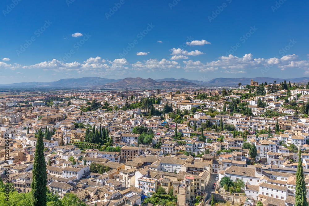 Panoramic view over Granada with the old town, the Arabian quarter Albaicin and the mountains In the background