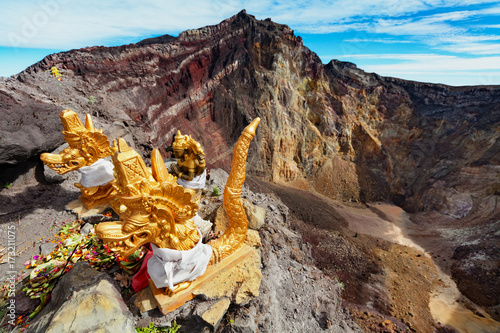 Canvas Print Balinese hindu shrine on brink of volcanic crater with traditional religious offering for volcano spirits protecting against eruption