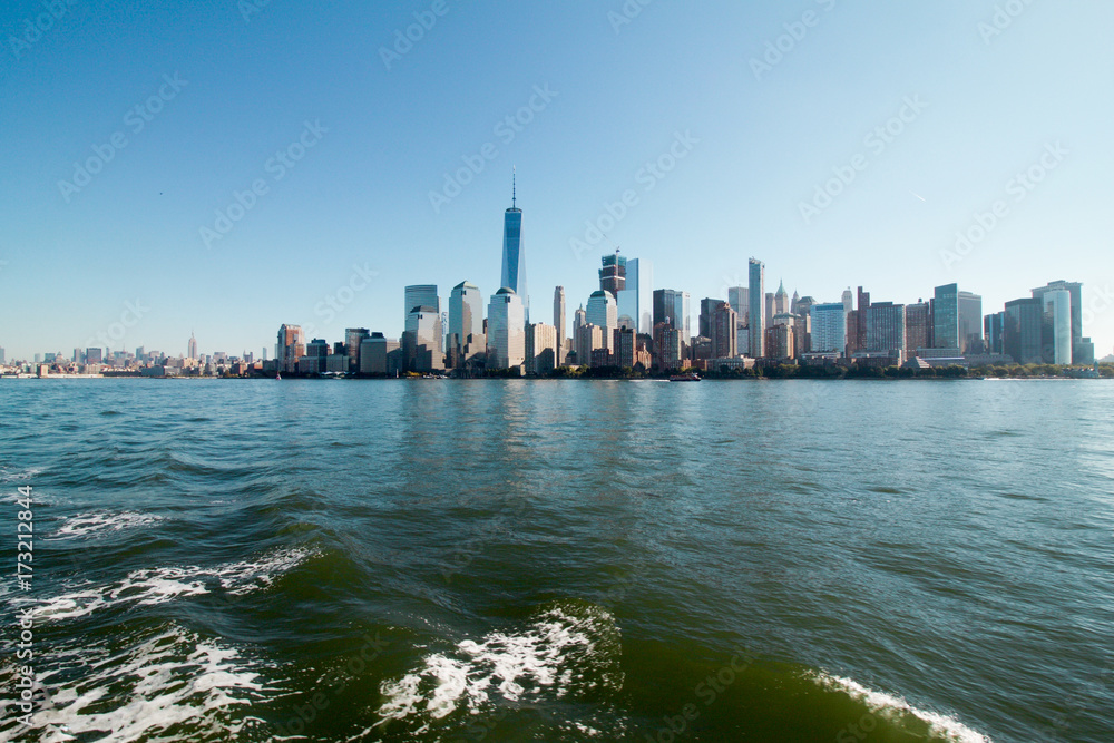 Manhattan skyline with freedom tower from a boat