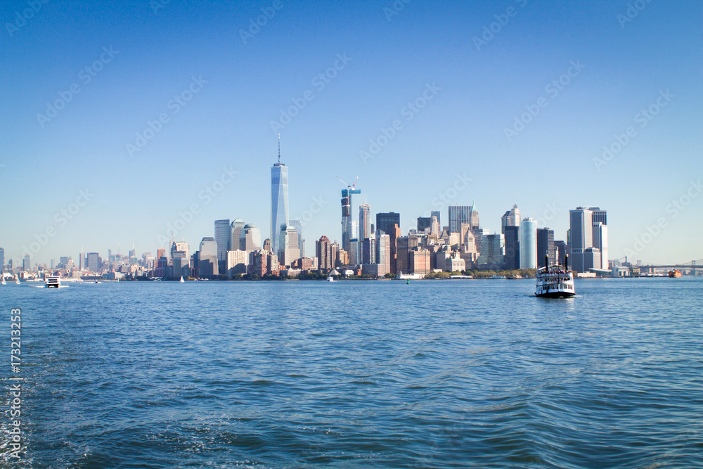 Manhattan skyline with boats in the bay