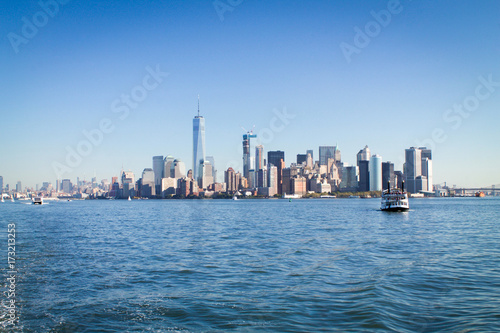 Manhattan skyline with boats in the bay