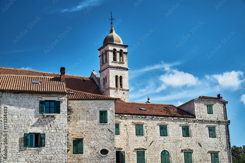 stone houses and church bell tower in the city of Sibenik in Croatia. stone houses and church bell tower in the city of Sibenik in Croatia.