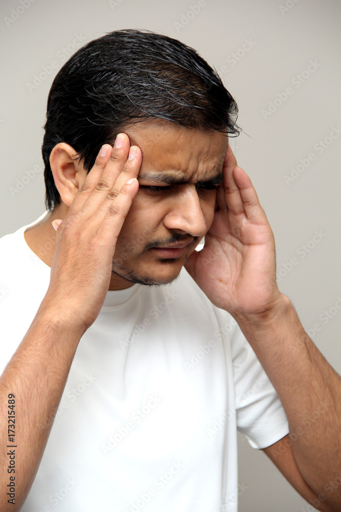 head ache, man in stress, expressions of young amazed man isolated on gray background head ache, man in stress, expressions of young amazed man isolated on gray background