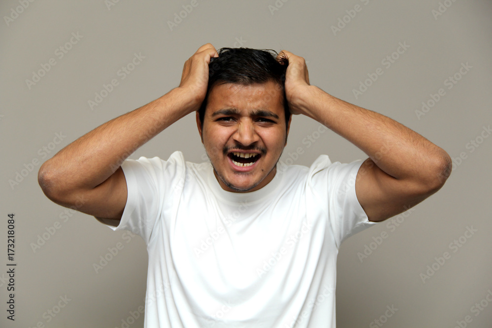 expressions of young amazed man isolated on gray background expressions of young amazed man isolated on gray background