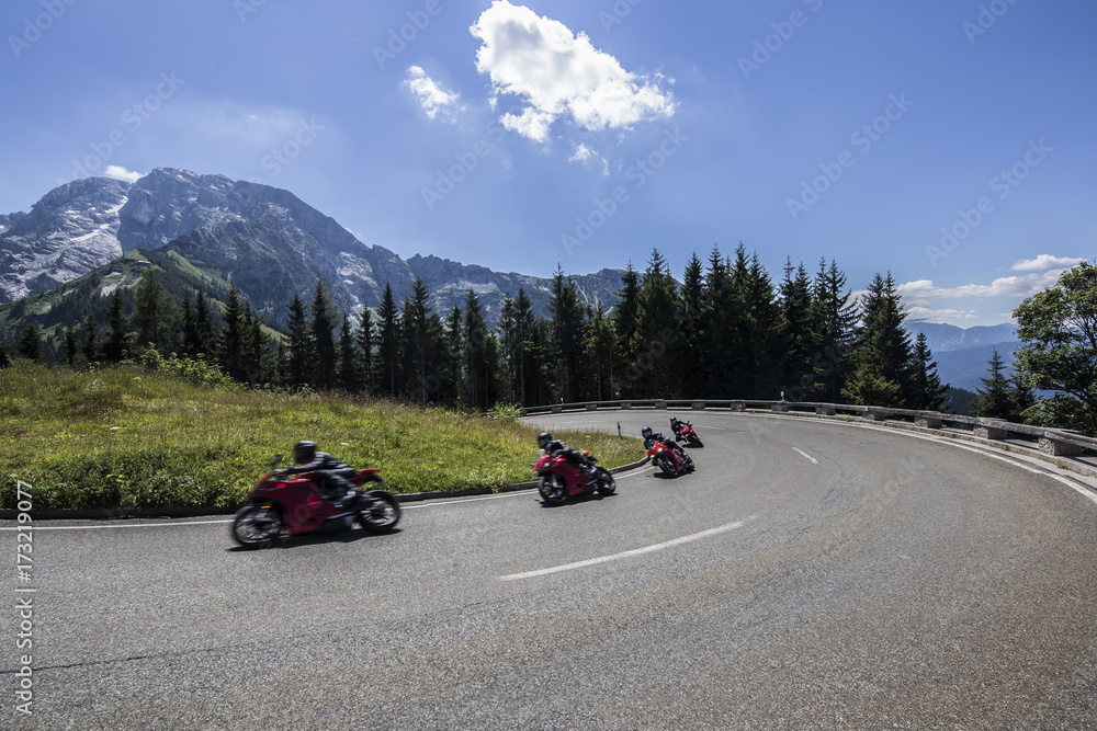 photo secuence of young man riding motorcycle in asphalt road curve with rural and mountain background