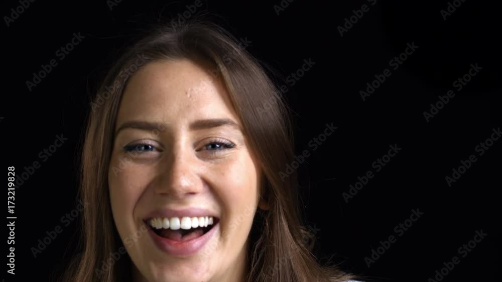 Close Up Of Attractive Young Woman Laughing Into Camera Close Up Of Attractive Young Woman Laughing Into Camera