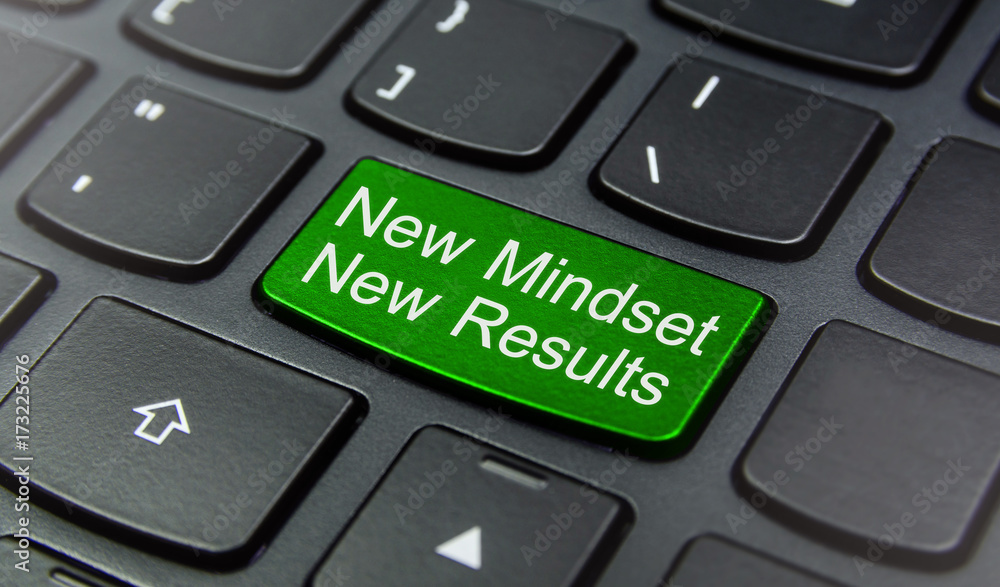 Close-up the New Mindset New Results button on the keyboard and have Green color button isolate black keyboard Close-up the New Mindset New Results button on the keyboard and have Green color button isolate black keyboard
