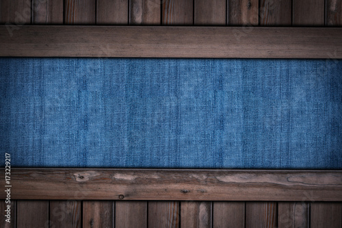 abstract blue jeans texture on wooden background
