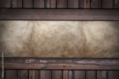 brown leather texture on wooden background .