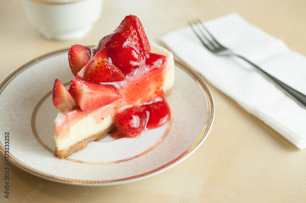 Close up strawberry cheesecake on white plate Close up strawberry cheesecake on white plate