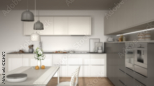 Blur background interior design, modern kitchen with table and chairs, herringbone parquet floor