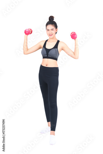 Young Asian woman in sportswear lifting red dumbbells isolated on white background