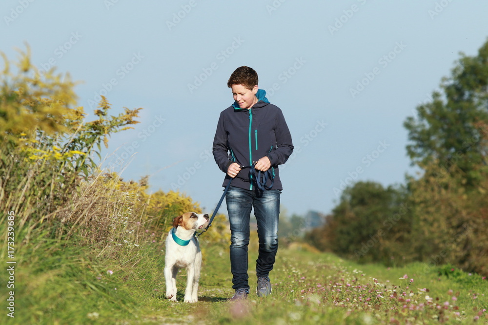 Sportive woman walks her dog in autumn Sportive woman walks her dog in autumn