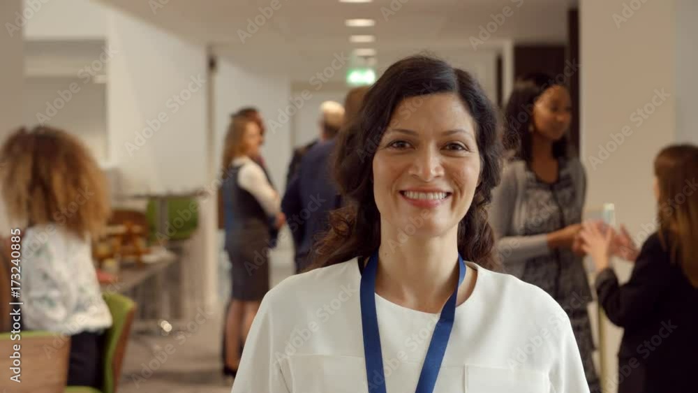 Portrait Of Female Delegate During Break At Conference Portrait Of Female Delegate During Break At Conference