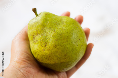 pears in basket on table .