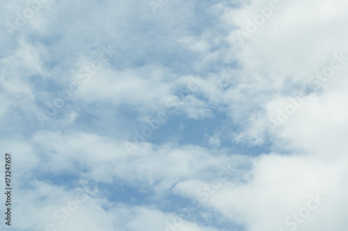 Fototapeta Naklejka Na Ścianę i Meble -  Blue sky background with tiny clouds. White fluffy clouds in the blue sky