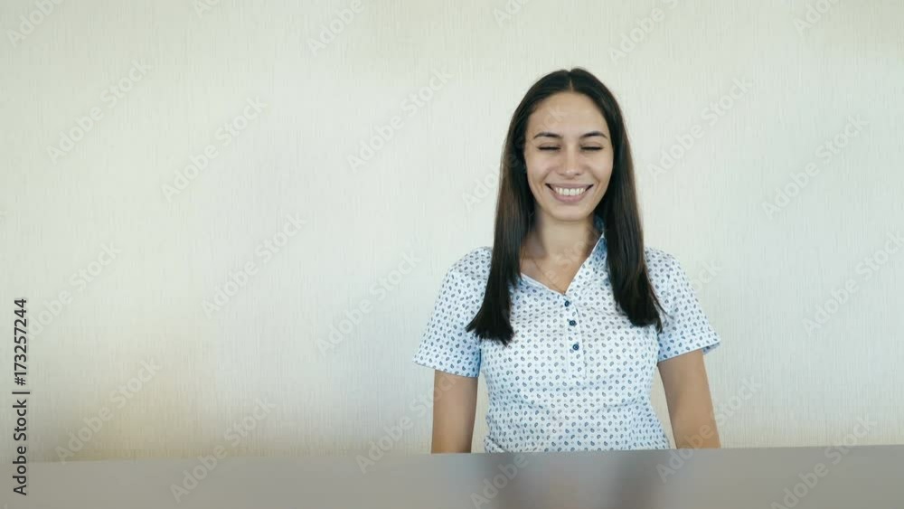 Portrait of a attractive smiling woman at the reception or the hotel company. People stock footage shot. Portrait of a attractive smiling woman at the reception or the hotel company. People stock footage shot.