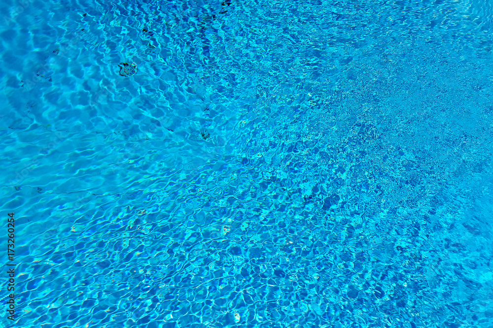 Blue water surface and ripple wave in swimming pool