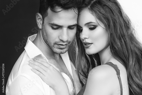 Fashion portrait of a beautiful sexy couple. Black and white image