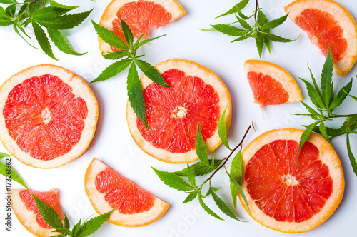 Grapefruit slices and marijuana leaves