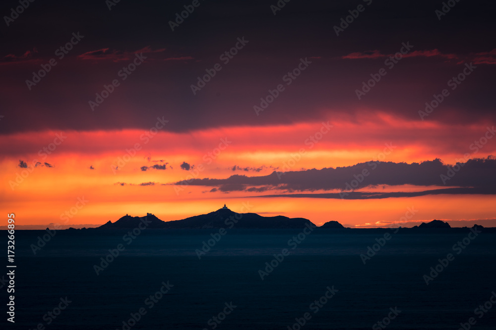 Iles Sanguinaires silhouetted against a dramatic orange sunset