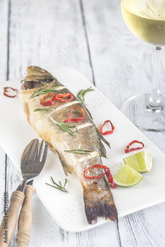 Baked sea bass with lime and chilli pepper