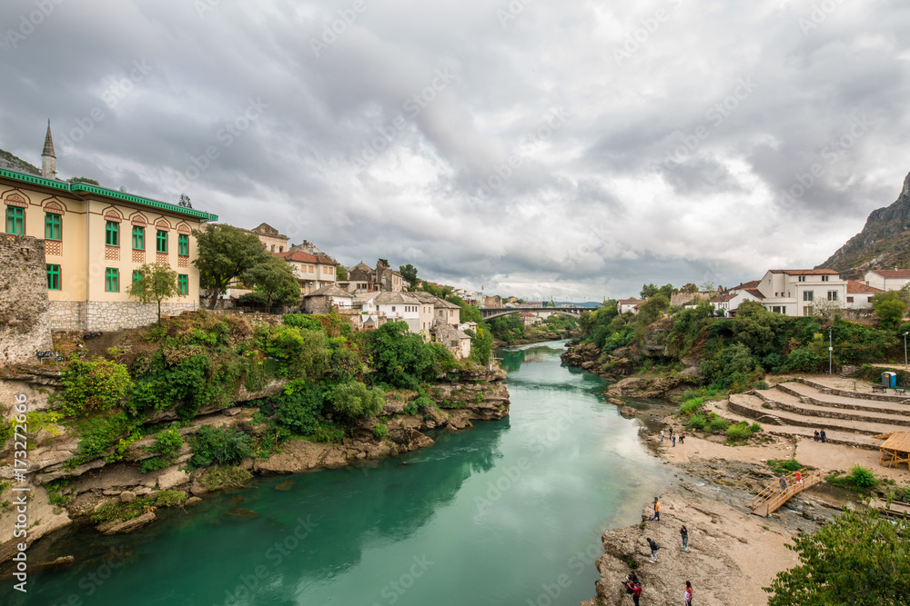 The World Heritage Site Old Bridge Of Mostar City With Emerald River Neretva In Southern Part Of  Bosnia-Herzegovina In Eastern Europe Where West Meets East