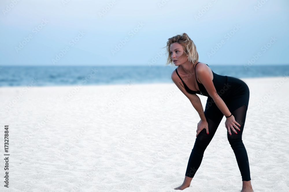 Runner woman running in the beach at sunset Runner woman running in the beach at sunset