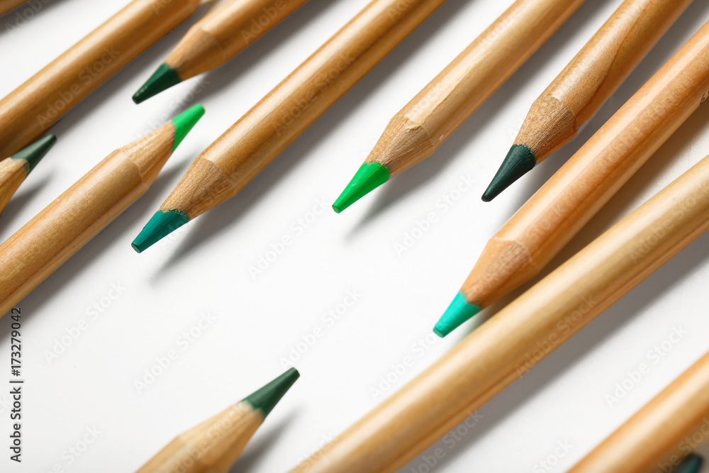 Obraz premium Pencils of green shades on white background