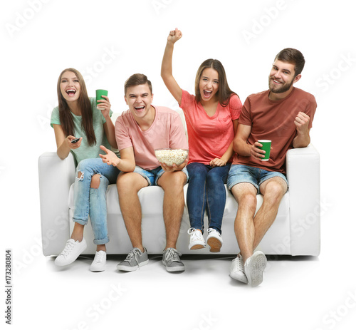 Friends watching TV on sofa...
