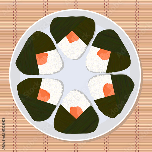Onigiri (japanese rice ball) filled with salmon. Lunch texture. Japanese cuisine. Lunch Illustration. Asian snack plate on the japanese bamboo mat.