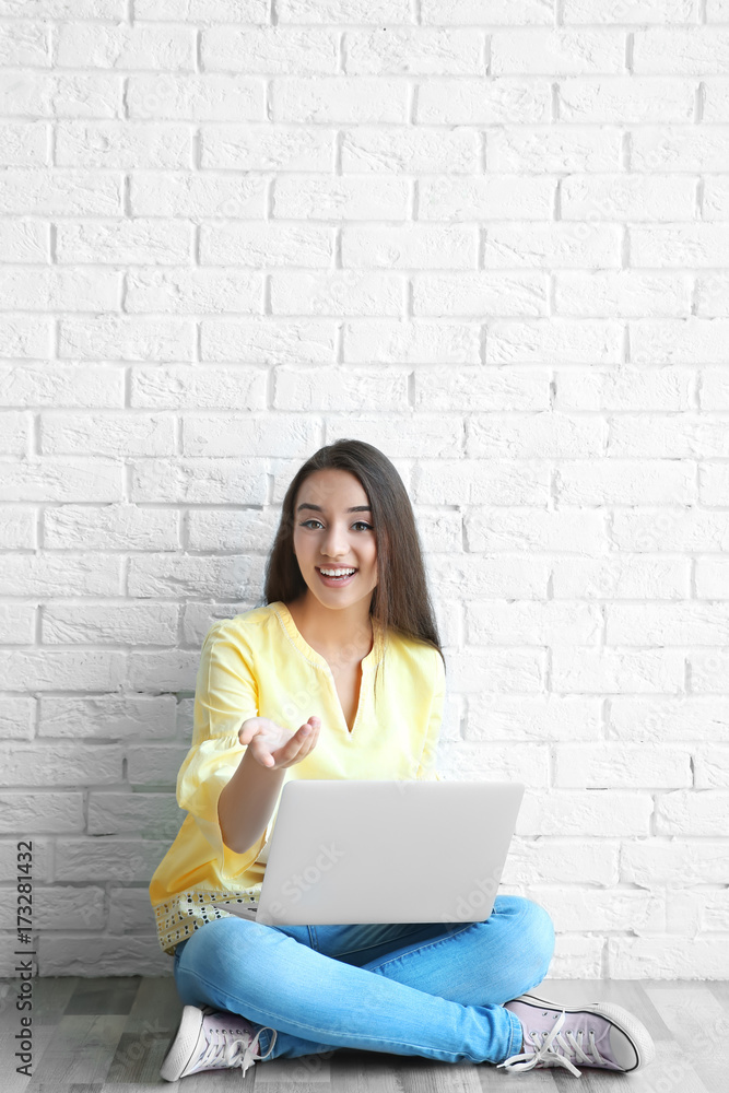 Young female blogger with laptop at home Young female blogger with laptop at home