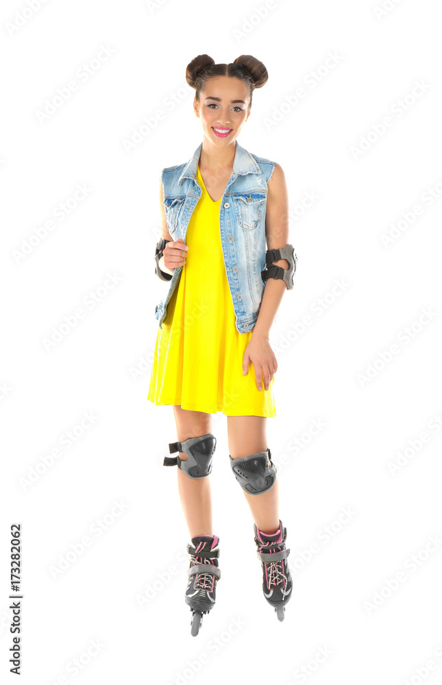 Beautiful young woman on roller skates against white background Beautiful young woman on roller skates against white background