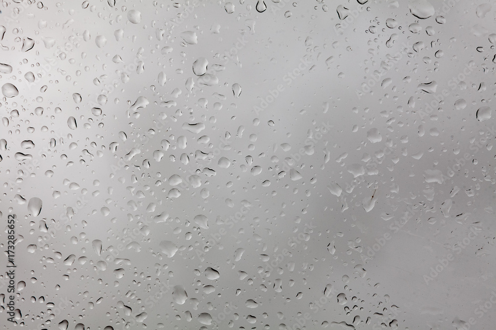 weather, background, uniqueness concept. close up of the window, there are lots of rain drops on it, they are like snowflakes very special, each has its own size and form weather, background, uniqueness concept. close up of the window, there are lots of rain drops on it, they are like snowflakes very special, each has its own size and form