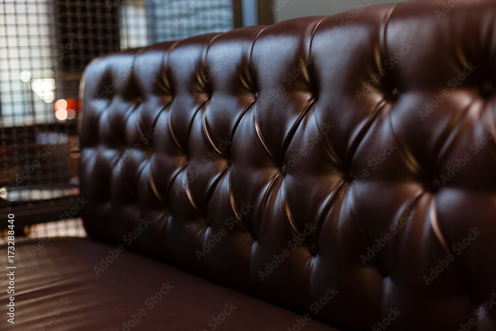 Naklejka premium Genuine leather upholstery background for a luxury decoration in Brown tones