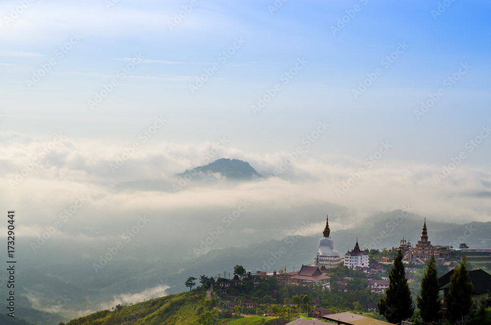 View point of Wat Prathat Phasornkaew at blue sky background at Phetchabun province Thailand. Fog and cloud in mountain valley landscape.