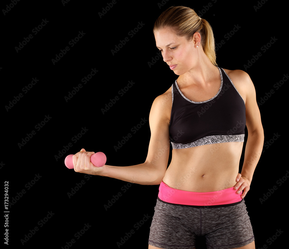 Woman lifting weights while doing aerobics. Woman lifting weights while doing aerobics.