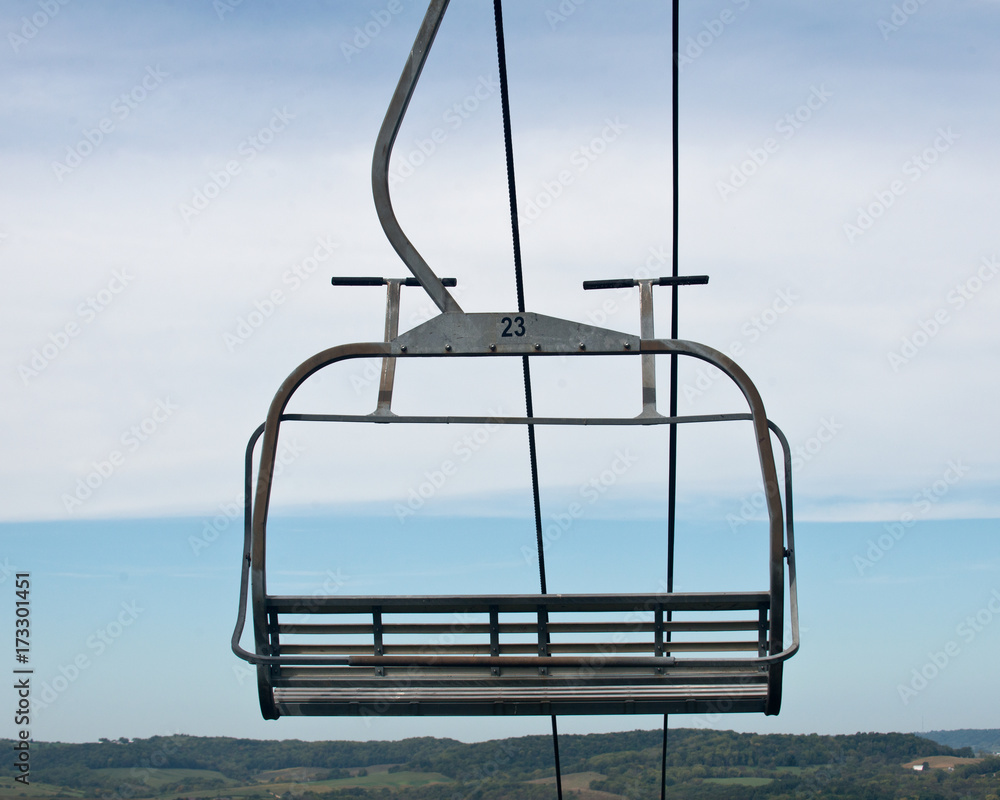 Mountain ski lift chair waiting to be used during winter season Mountain ski lift chair waiting to be used during winter season