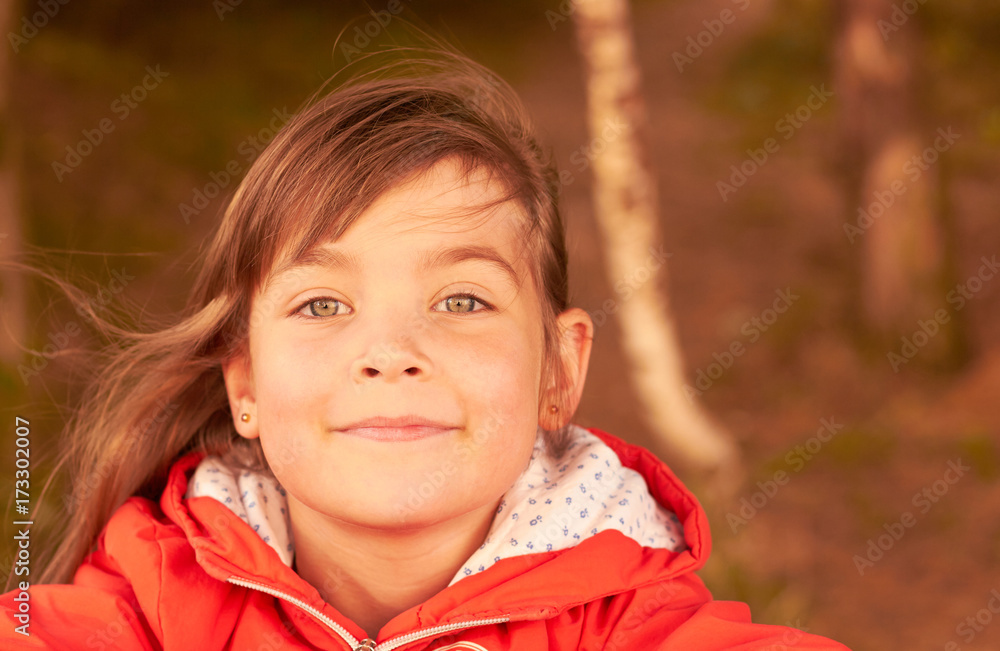 cute little girl in the park at the table cute little girl in the park at the table