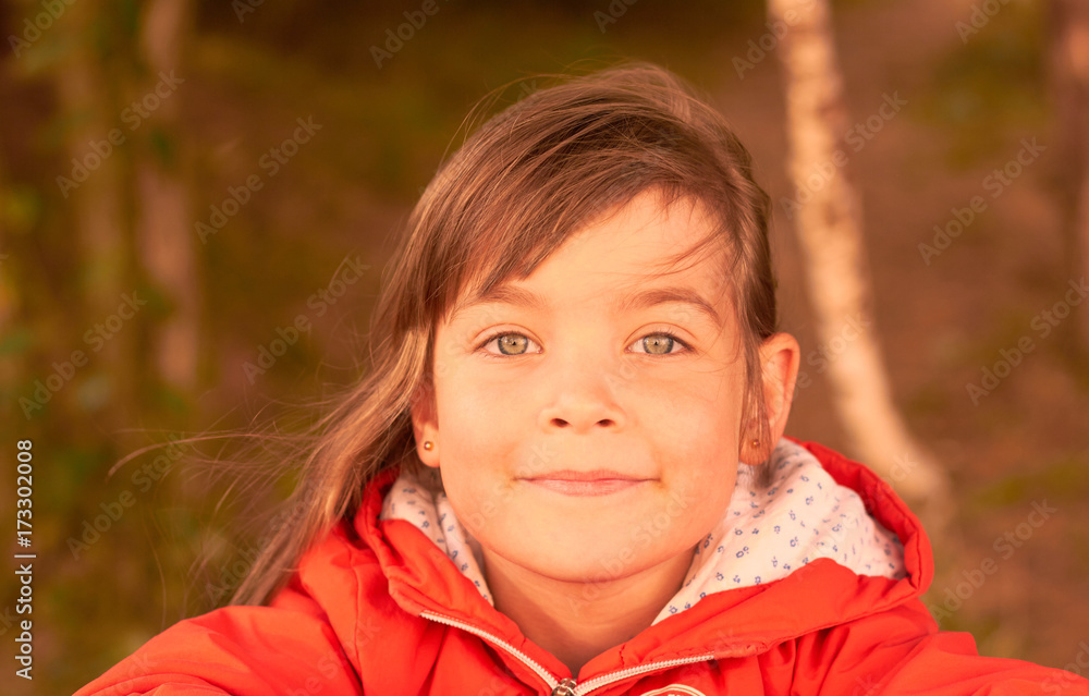 cute little girl in the park at the table cute little girl in the park at the table