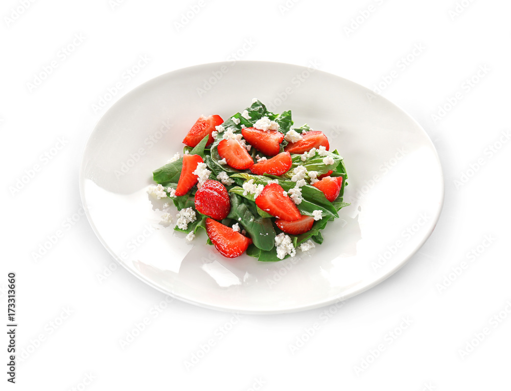 Plate with strawberry spinach salad on white background Plate with strawberry spinach salad on white background