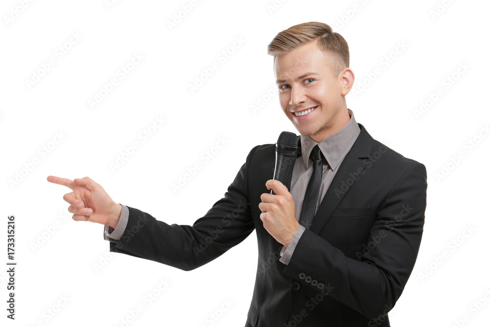 Young presenter with microphone on white background - obrazy, fototapety, plakaty 